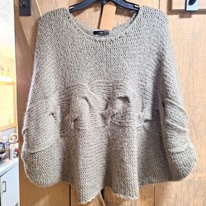 A Papaya Small/Medium cable knit sweater in 100% acrylic with Dolman sleeves